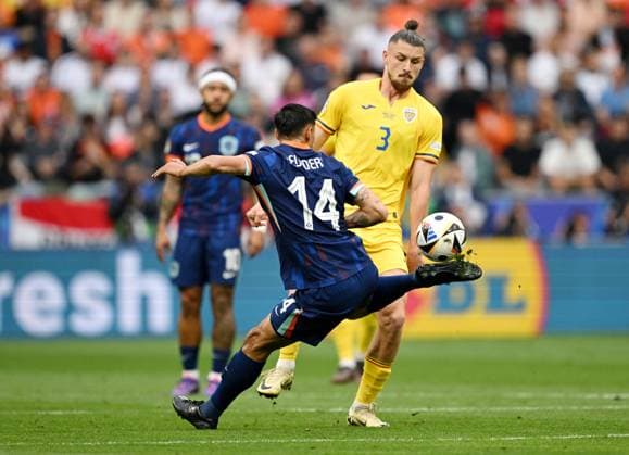 Germany Soccer Euro 2024 Romania - Netherlands 8721250 02.07.2024 Netherlands Tijjani Reijnders, left, and Romania s Radu Dragusin struggle for a ball during the UEFA EURO, EM, Europameisterschaft,Fussball 2024 round of 16 soccer match between Romania and Netherlands at the Munich Football Arena in Munich, Germany. Alexey Filippov Sputnik Munich Germany  Copyright: xAlexeyxFilippovx