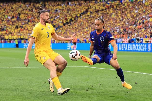 Football - UEFA EURO, EM, Europameisterschaft,Fussball 2024 - Round of 16 - Romania v Netherlands 2nd July 2024 - UEFA EURO 2024 - Round of 16 - Romania v Netherlands - Xavi Simons of Netherlands and Radu Dragusin of Romania - Photo: Simon Stacpoole Offside. Munich Germany Copyright: xSimonxStacpoolexOffside