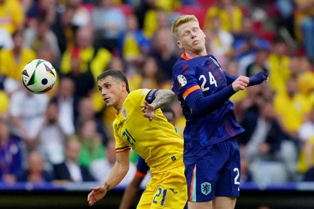 Romania s Nicolae Stanciu fight for the ball withJerdy Schouten of the Netherlands during the Euro 2024 soccer match between Romania and Netherlands at the Munich Football Arena , Munich , Germany - Tuesday July 2 , 2024. - Soccer .  Copyright: xSpada LaPressex