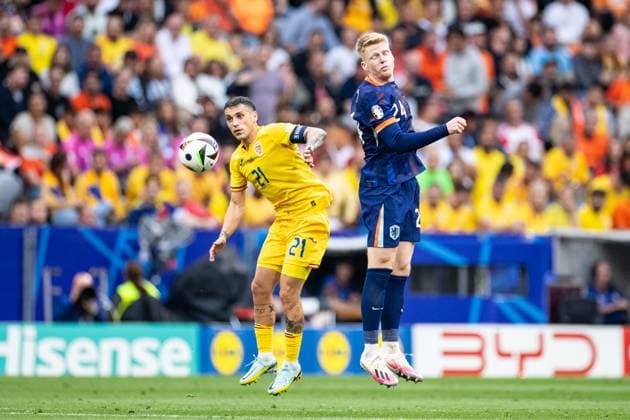 UEFA EURO, EM, Europameisterschaft,Fussball 2024: Rumänien - Niederlande; 02.07.2024 Nicolae Stanicu (Rumänien, 21), Jerdy Schouten (Niederlande, 24) UEFA EURO 2024: Rumänien - Niederlande; Munich Football Arena, München; 02.07.2024 Copyright: xBEAUTIFULxSPORTS Buriakovx
