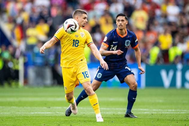 UEFA EURO, EM, Europameisterschaft,Fussball 2024: Rumänien - Niederlande; 02.07.2024 Razvan Marin (Rumänien, 18), Tijjani Reijnders (Niederlande, 14) UEFA EURO 2024: Rumänien - Niederlande; Munich Football Arena, München; 02.07.2024 Copyright: xBEAUTIFULxSPORTS Buriakovx