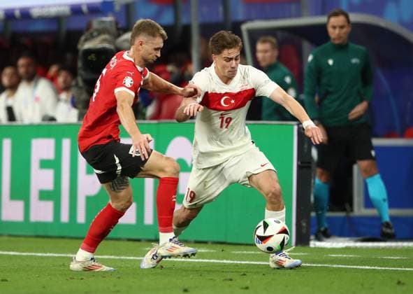 02.07.2024, xtgx, Fussball EM 2024 1 8 Finale, Österreich - Türkei emspor, v.l. Stefan Posch (Oesterreich), Kenan Yildiz (Türkei Tuerkei) (UEFA REGULATIONS PROHIBIT ANY USE OF PHOTOGRAPHS as IMAGE SEQUENCES and or QUASI-VIDEO) Leipzig