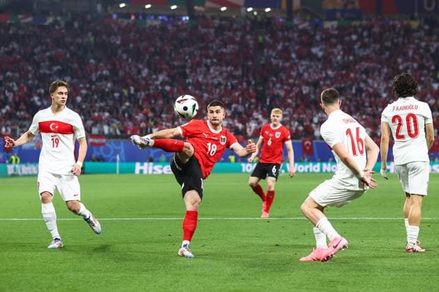 Austria v Turkey 2 July 2024, Leipzig - UEFA EUROs - Round of 16 - Austria v Turkey - Romano Schmid of Austria volleys the ball - Photo: Charlotte Wilson Offside. Leipzig Germany Copyright: xCharlottexWilsonx xOffsidexOffside