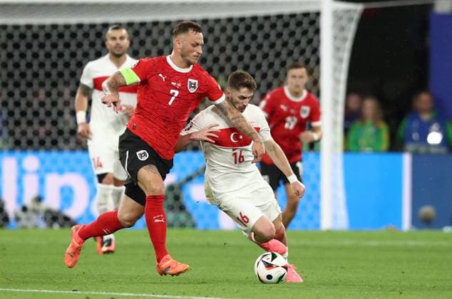 02.07.2024, xtgx, Fussball EM 2024 1 8 Finale, Österreich - Türkei emspor, v.l. Marko Arnautovic (Oesterreich), Ismail Yüksek (Türkei Tuerkei) (UEFA REGULATIONS PROHIBIT ANY USE OF PHOTOGRAPHS as IMAGE SEQUENCES and or QUASI-VIDEO) Leipzig