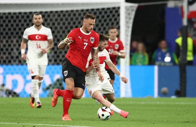 02.07.2024, xtgx, Fussball EM 2024 1 8 Finale, Österreich - Türkei emspor, v.l. Marko Arnautovic (Oesterreich), Ismail Yüksek (Türkei Tuerkei) (UEFA REGULATIONS PROHIBIT ANY USE OF PHOTOGRAPHS as IMAGE SEQUENCES and or QUASI-VIDEO) Leipzig