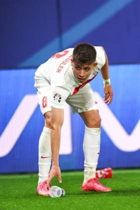 Austria v Turkey 2 July 2024, Leipzig - UEFA EUROs - Round of 16 - Austria v Turkey - Arda Guler of Turkey throws away a cup of beer that was chucked in his direction from opposition fans - Photo: Charlotte Wilson Offside. Leipzig Germany Copyright: xCharlottexWilsonx xOffsidexOffside