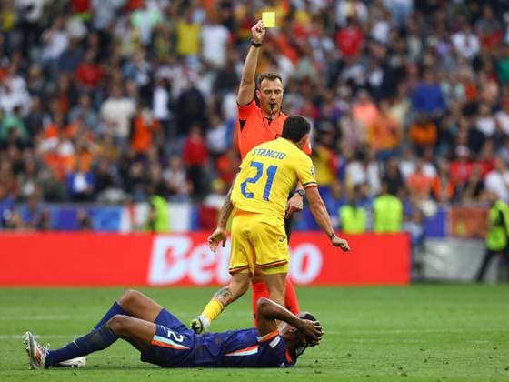July 2, 2024, Munich, Bavaria, Germany: NICOLAE STANCIU 21 of Team Romania receives a yellow card for an apparent foul on DENZEL DUMFRIES 22 of Team Netherlands during the UEFA EURO, EM, Europameisterschaft,Fussball 2024 Round of 16 between ROMANIA and NETHERLANDS at Allianz Arena in Munich, Germany Munich Germany - ZUMAc179 20240702_zep_c179_098 Copyright: xMickaelxChavetx