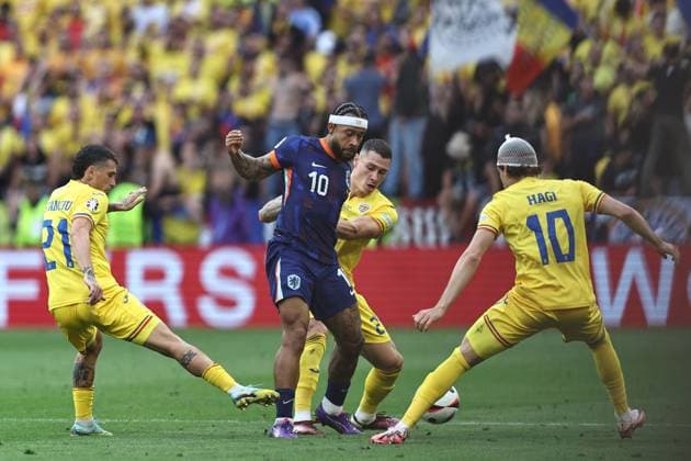 Nicolae Stanciu (Romania)Memphis Depay (Netherlands)Bogdan Racovitan (Romania)Ianis Hagi (Romania) during the UEFA EURO, EM, Europameisterschaft,Fussball Germany 2024 match between Romania 0-3 Netherlands at Munich Football Arena on July 02, 2024 in Munich , Germany. Noxthirdxpartyxsales  (258440207)