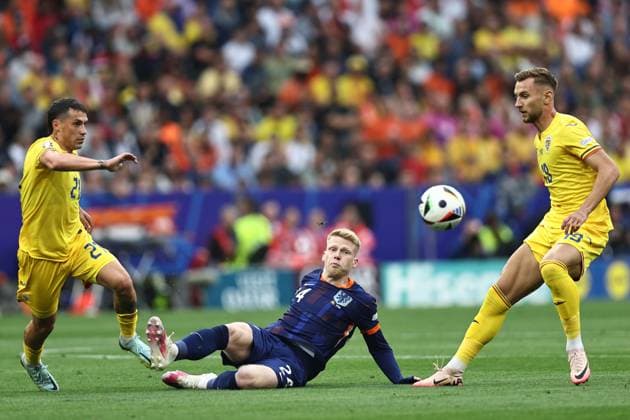 Nicolae Stanciu (Romania)Jerdy Schouten (Netherlands)Denis Dragus (Romania) during the UEFA EURO, EM, Europameisterschaft,Fussball Germany 2024 match between Romania 0-3 Netherlands at Munich Football Arena on July 02, 2024 in Munich , Germany. Noxthirdxpartyxsales  (258440332)