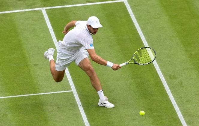 (240704) -- LONDON, July 4, 2024 -- Aleksandar Vukic of Australia hits a return during the men s singles second round match between Aleksandar Vukic of Australia and Carlos Alcaraz of Spain at Wimbledon tennis Championship in London, Britain, July 3, 2024. ) (SP)BRITAIN-LONDON-TENNIS-WIMBLEDON-MEN S SINGLES HanxYan 