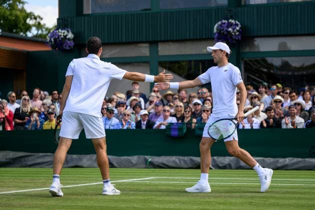 240704 Casper Ruud of Norway and William Blumberg of USA compete in a first round doubles match during day 4 of Wimbledon on July 4, 2024 in London. Photo: Jesper Zerman BILDBYRAN kod JZ JZ0550 tennis wimbledon dag 4 bbeng Copyright: JESPERxZERMAN BB240704JZ022