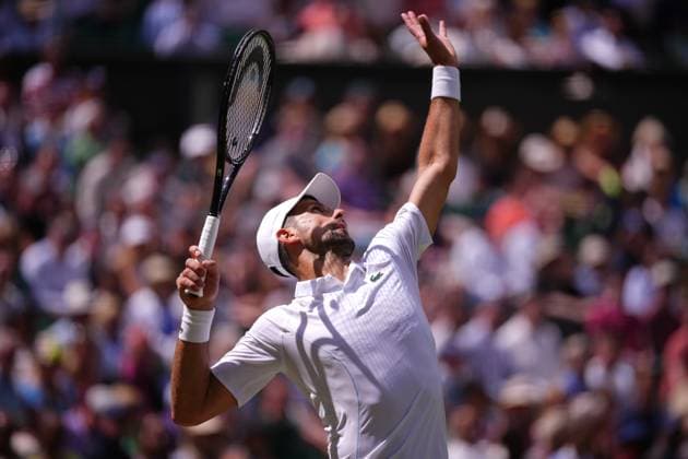 Serbia s Novak Djokovic serves the ball to Britain s Jacob Feamley during their men s singles tennis match on the fourth day of the 2024 Wimbledon Championships at The All England Lawn Tennis and Croquet Club in Wimbledon, southwest London, on July 4, 2024.  Copyright: xHiroshixSatox