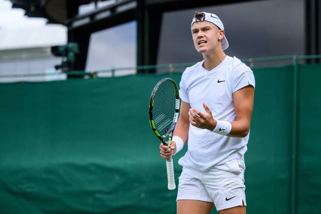 240704 Holger Rune of Denmark competes in a second round singles match during day 4 of Wimbledon on July 4, 2024 in London. Photo: Jesper Zerman BILDBYRAN kod JZ JZ0550 tennis wimbledon dag 4 bbeng Copyright: JESPERxZERMAN BB240704JZ095