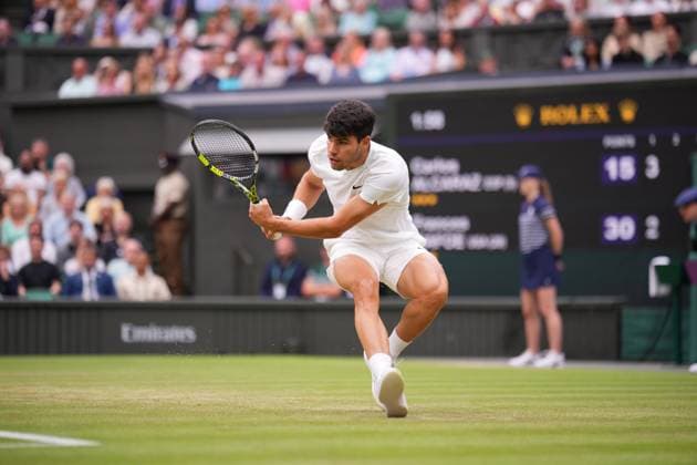 LONDON, ENGLAND - JULY 05: Carlos Alcaraz of Spain stretches to play a backhand against Frances Tiafoe of United States in his Gentlemen s Singles third round match during day five of The Championships Wimbledon 2024 at All England Lawn Tennis and Croquet Club on July 05, 2024 in London, England.  Copyright: xHiroshixSatox