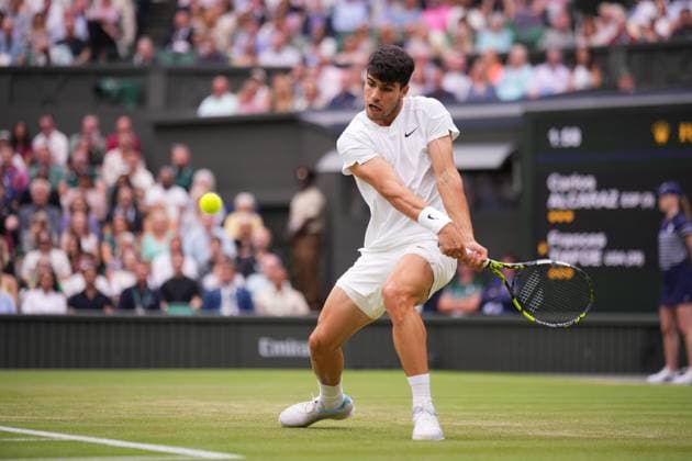 LONDON, ENGLAND - JULY 05: Carlos Alcaraz of Spain stretches to play a backhand against Frances Tiafoe of United States in his Gentlemen s Singles third round match during day five of The Championships Wimbledon 2024 at All England Lawn Tennis and Croquet Club on July 05, 2024 in London, England.  Copyright: xHiroshixSatox