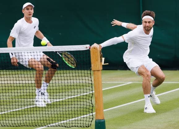 Belgian pair Joran Vliegen - Sander Gille pictured in action during a doubles tennis match against Argentinian pair Etcheverry-Cerundolo, in the first round of the men s doubles competition of the 2024 Wimbledon grand slam tournament at the All England Tennis Club, in south-west London, Britain, Friday 05 July 2024. BENOITxDOPPAGNE  x95888498x