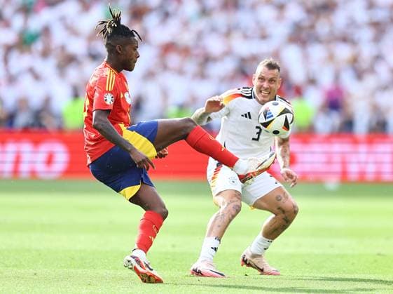 Nico Williams of Spain is challenged by David Raum of Germany Spain v Germany, UEFA European Championship, EM, Europameisterschaft 2024, Quarter Final, Football, Stuttgart Arena, Stuttgart, Germany, 05 Jul 2024 EDITORIAL USE ONLY No use with unauthorised audio, video, data, fixture lists, club league logos or live services. Online in-match use limited to 120 images, no video emulation. No use in betting, games or single club league player publications. Copyright: xMichaelxZemanek Shutterstockx 14571380aw