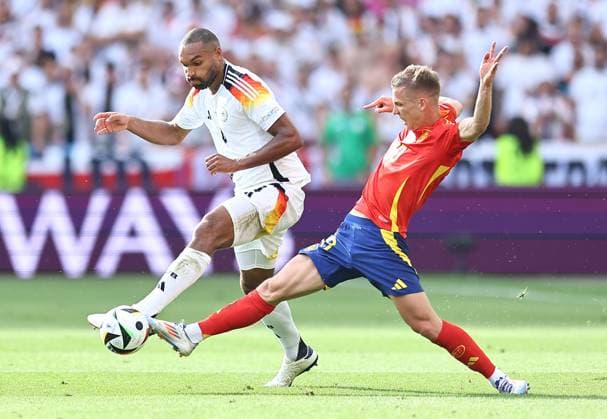 Jonathan Tah of Germany is challenged by Dani Olmo of Spain Spain v Germany, UEFA European Championship, EM, Europameisterschaft 2024, Quarter Final, Football, Stuttgart Arena, Stuttgart, Germany, 05 Jul 2024 EDITORIAL USE ONLY No use with unauthorised audio, video, data, fixture lists, club league logos or live services. Online in-match use limited to 120 images, no video emulation. No use in betting, games or single club league player publications.  Copyright: xMichaelxZemanek Shutterstockx 14571380bd