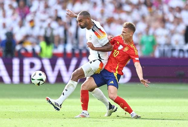 Jonathan Tah of Germany is challenged by Dani Olmo of Spain Spain v Germany, UEFA European Championship, EM, Europameisterschaft 2024, Quarter Final, Football, Stuttgart Arena, Stuttgart, Germany, 05 Jul 2024 EDITORIAL USE ONLY No use with unauthorised audio, video, data, fixture lists, club league logos or live services. Online in-match use limited to 120 images, no video emulation. No use in betting, games or single club league player publications.  Copyright: xMichaelxZemanek Shutterstockx 14571380bi