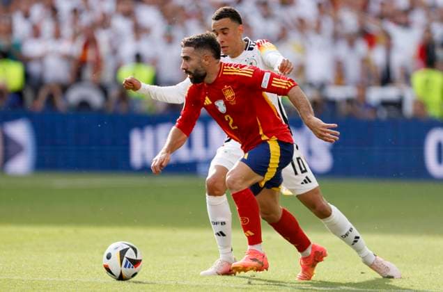 Spain v Germany: Quarter-Final - UEFA EURO, EM, Europameisterschaft,Fussball 2024 Daniel Carvajal of Spain and Jamal Musiala of Germany challenge during the UEFA EURO 2024 quarter-final match between Spain and Germany at Stuttgart Arena on July 5, 2024 in Stuttgart, Germany. Stuttgart Stuttgart Arena Germany Germany Copyright: xRichardxSellers Sportsphoto APLx 14044152