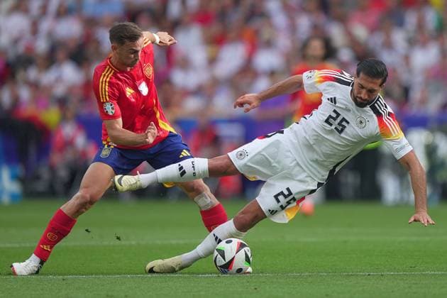 Spain s Fabian Ruiz fight for the ball with Germany s Emre Can during the Euro 2024 soccer match between Spain and Germany at the Stuttgart Arena , Stuttgart , Germany - Friday 05 july 2024. - Soccer .  Copyright: xSpada LaPressex