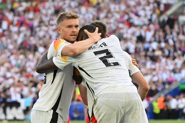 05.07.2024, xjrdrx, Fussball EM 2024 1 4 Finale, Deutschland - Spanien emspor, v.l. Torjubel nach dem Tor zum celebrating the goal celebrate 1:1 durch Florian Wirtz (Deutsche Fussball Nationalmannschaft DFB) Maximilian Mittelstädt (Deutsche Fussball Nationalmannschaft DFB) Antonio Rüdiger (Deutsche Fussball Nationalmannschaft DFB) (DFL DFB REGULATIONS PROHIBIT ANY USE OF PHOTOGRAPHS as IMAGE SEQUENCES and or QUASI-VIDEO) Stuttgart