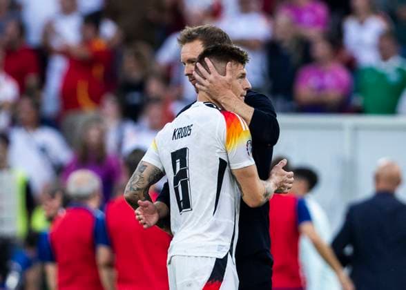 Stuttgart, MHPArena 05.07.2024: Head coach Julian Nagelsmann of germany comforts Toni Kroos of germany during the quarterfinal match Spain v. Germany at the UEFA European Championship, EM, Europameisterschaft 2024.