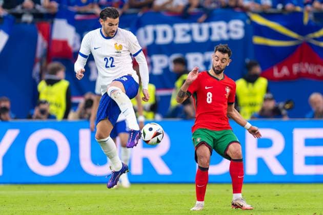 2024-07-05 Portugal v France - Quarter-Final - UEFA EURO, EM, Europameisterschaft,Fussball 2024 HAMBURG, GERMANY - JULY 5: Theo Hernandez of France battles for the ball with Bruno Fernandes of Portugal during the Quarter-Final - UEFA EURO 2024 match between Portugal and France at Volksparkstadion on July 5, 2024 in Hamburg, Germany. (Photo by Joris Verwijst BSR Agency) Hamburg Germany Content not available for redistribution in The Netherlands directly or indirectly through any third parties. Copyright: xBSRxAgencyx