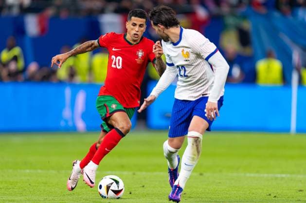 2024-07-05 Portugal v France - Quarter-Final - UEFA EURO, EM, Europameisterschaft,Fussball 2024 HAMBURG, GERMANY - JULY 5: Joao Cancelo of Portugal battles for the ball with Theo Hernandez of France during the Quarter-Final - UEFA EURO 2024 match between Portugal and France at Volksparkstadion on July 5, 2024 in Hamburg, Germany. (Photo by Joris Verwijst BSR Agency) Hamburg Germany Content not available for redistribution in The Netherlands directly or indirectly through any third parties. Copyright: xBSRxAgencyx