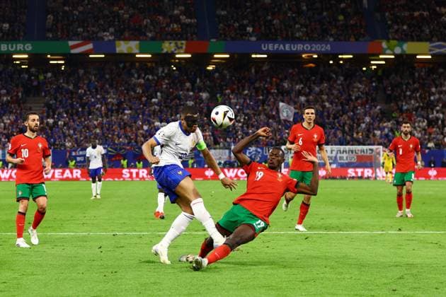 Nuno Mendes of Portugal blocks a shot from Kylian MbappÃ of France Portugal v France, UEFA European Championship, EM, Europameisterschaft 2024, Quarter Final, Football, Volksparkstadion, Hamburg, Germany, 05 Jul 2024 EDITORIAL USE ONLY No use with unauthorised audio, video, data, fixture lists, club league logos or live services. Online in-match use limited to 120 images, no video emulation. No use in betting, games or single club league player publications.  Copyright: xKieranxMcManus Shutterstockx 14571382bp