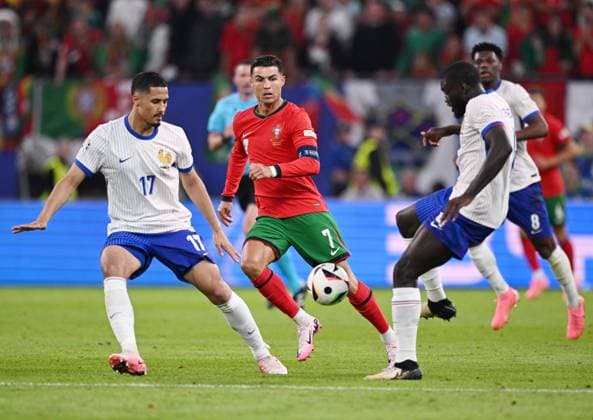 Russia Soccer Euro 2024 Portugal - France 8723204 05.07.2024 France s William Saliba, Portugal s Cristiano Ronaldo and France s Dayot Upamecano struggle for the ball during the UEFA EURO, EM, Europameisterschaft,Fussball 2024 quarter final soccer match between Portugal and France at the Volksparkstadion in Hamburg, Germany. Alexey Filippov Sputnik Hamburg Germany  Copyright: xAlexeyxFilippovx