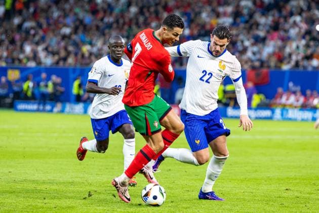 Portugal v France: Quarter-Final - UEFA EURO, EM, Europameisterschaft,Fussball 2024 Cristiano Ronaldo, Theo Hernandez are playing during the UEFA Euro 2024 Quarter-Final match between Portugal v France, at the stadium in Hamburg, Germany, on July 5, 2024. Hamburg Germany  Copyright: xAndrzejxIwanczukx originalFilename:iwanczuk-portugal240705_npHWa.jpg