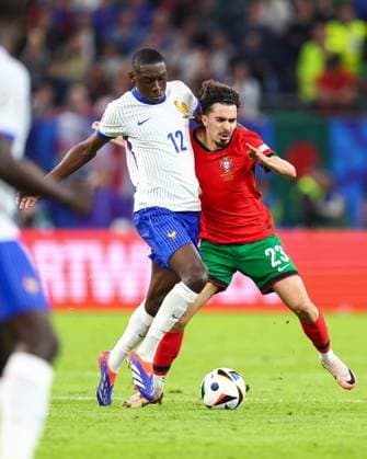 Portugal v France 5 July 2024, Hamburg - UEFA EUROs - Quarter-Final - Portugal v France - Randal Kolo Muani of France and Vitinha of Portugal - Photo: Charlotte Wilson Offside. Hamburg Germany Copyright: xCharlottexWilsonx xOffsidexOffside