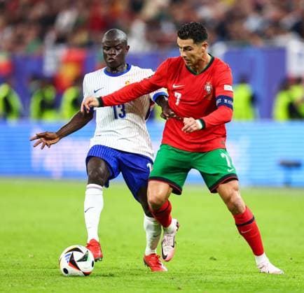 Portugal v France 5 July 2024, Hamburg - UEFA EUROs - Quarter-Final - Portugal v France - Ngolo Kante of France and Cristiano Ronaldo of Portugal - Photo: Charlotte Wilson Offside. Hamburg Germany Copyright: xCharlottexWilsonx xOffsidexOffside