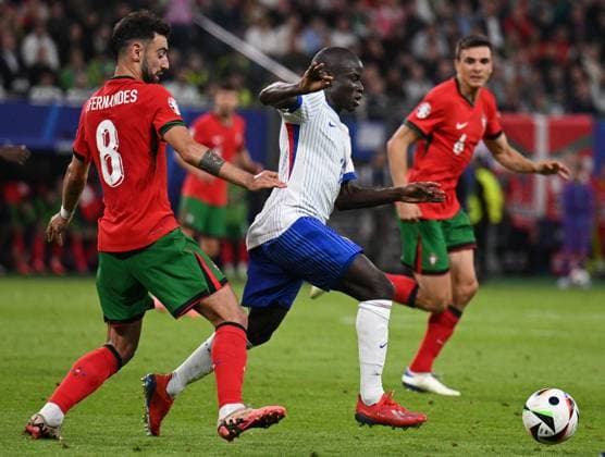 Russia Soccer Euro 2024 Portugal - France 8723246 05.07.2024 Portugal s Bruno Fernandes and France s N Golo Kante struggle for the ball during the UEFA EURO, EM, Europameisterschaft,Fussball 2024 quarter final soccer match between Portugal and France at the Volksparkstadion in Hamburg, Germany. Alexey Filippov Sputnik Hamburg Germany  Copyright: xAlexeyxFilippovx