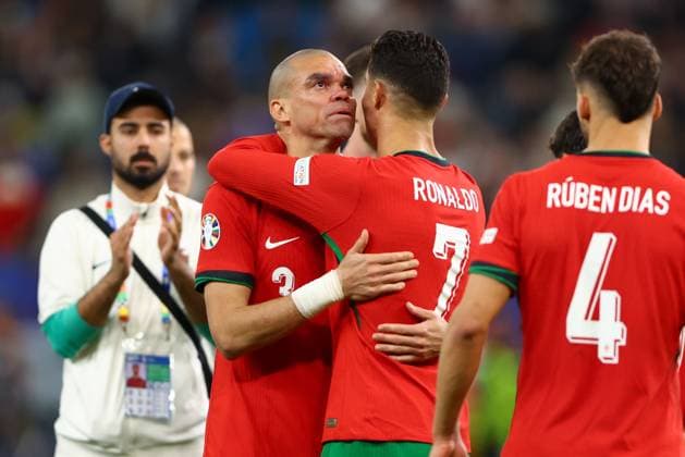 An emotional Cristiano Ronaldo of Portugal and Pepe of Portugal after the penalty shootout loss Portugal v France, UEFA European Championship, EM, Europameisterschaft 2024, Quarter Final, Football, Volksparkstadion, Hamburg, Germany, 05 Jul 2024 EDITORIAL USE ONLY No use with unauthorised audio, video, data, fixture lists, club league logos or live services. Online in-match use limited to 120 images, no video emulation. No use in betting, games or single club league player publications.  Copyright: xKieranxMcManus Shutterstockx 14571382de