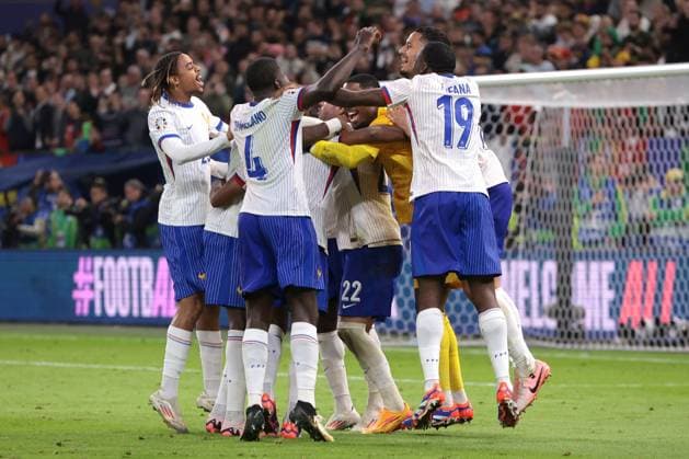 Hamburg, Germany, 5th July 2024. France players celebrate the penalty shoot out victory after Theo Hernandez of France scored the decisive spot kick during the UEFA European Championships quarter final match at Volksparkstadion, Hamburg. Picture credit should read: Jonathan Moscrop Sportimage EDITORIAL USE ONLY. No use with unauthorised audio, video, data, fixture lists, club league logos or live services. Online in-match use limited to 120 images, no video emulation. No use in betting, games or single club league player publications. SPI-3219-0015