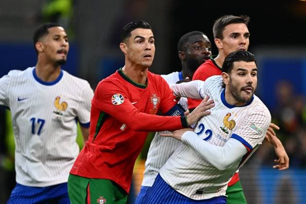 HAMBURG, GERMANY - JULY 5: Cristiano Ronaldo of Portugal and Theo Hernandez of France in action during the UEFA EURO, EM, Europameisterschaft,Fussball 2024 quarter-final match between Portugal and France at Volksparkstadion on July 5, 2024 in Hamburg, G Portugal v France: Quarter-Final - UEFA EURO 2024 Copyright: xSebastianxFrejx