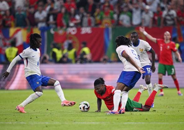 Russia Soccer Euro 2024 Portugal - France 8723212 05.07.2024 France s Eduardo Camavinga, Portugal s Rafael Leao and France s Jules Kounde struggle for the ball during the UEFA EURO, EM, Europameisterschaft,Fussball 2024 quarter final soccer match between Portugal and France at the Volksparkstadion in Hamburg, Germany. Alexey Filippov Sputnik Hamburg Germany  Copyright: xAlexeyxFilippovx