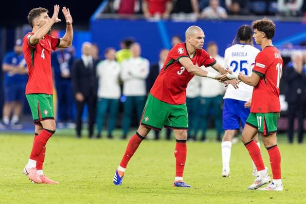 5th July 2024; Volksparkstadion, Hamburg, Germany; Euro 2024 Quarter Final Football, Portugal versus France; Ruben Dias (POR) and Pepe (POR) console Joao Felix (POR) who had just misses a penalty kick  ActionPlus12664510 FotoxOlimpik