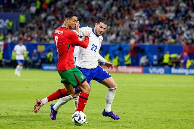 Portugal v France: Quarter-Final - UEFA EURO, EM, Europameisterschaft,Fussball 2024 Cristiano Ronaldo, Theo Hernandez are playing during the UEFA Euro 2024 Quarter-Final match between Portugal v France, at the stadium in Hamburg, Germany, on July 5, 2024. Hamburg Germany  Copyright: xAndrzejxIwanczukx originalFilename:iwanczuk-portugal240705_npkk9.jpg