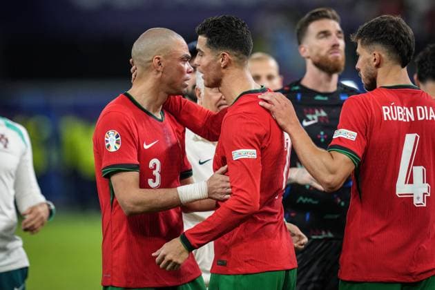 (240706) -- HAMBURG, July 6, 2024 -- Cristiano Ronaldo (C) of Portugal comforts Pepe after the UEFA EURO, EM, Europameisterschaft,Fussball 2024 quarter-final match between Portugal and France in Hamburg, Germany on July 5, 2024. ) (SP)GERMANY-HAMBURG-FOOTBALL-EURO 2024-QUARTER FINAL-PORTUGAL VS FRANCE PanxYulong 