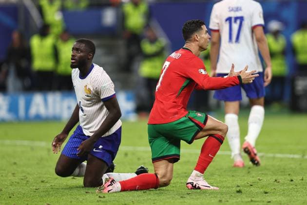Cristiano Ronaldo (Portugal) Dayot Upamecano (France) during the UEFA EURO, EM, Europameisterschaft,Fussball Germany 2024 match between Portugal 4-5 France at Volkspakstadion on July 05, 2024 in Hamburg , Germany. Noxthirdxpartyxsales  (258789702)