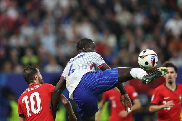 Dayot Upamecano (France) Bernardo Silva (Portugal) during the UEFA EURO, EM, Europameisterschaft,Fussball Germany 2024 match between Portugal 4-5 France at Volkspakstadion on July 05, 2024 in Hamburg , Germany. Noxthirdxpartyxsales  (258789982)