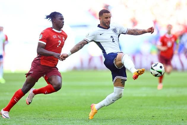 Breel Embolo of Switzerland and Kyle Walker of England England v Switzerland, UEFA European Championship, EM, Europameisterschaft 2024, Quarter Final, Football, Dusseldorf Arena, Dusseldorf, Germany, 06 Jul 2024 EDITORIAL USE ONLY No use with unauthorised audio, video, data, fixture lists, club league logos or live services. Online in-match use limited to 120 images, no video emulation. No use in betting, games or single club league player publications. Copyright: xMichaelxZemanek Shutterstockx 14571385at