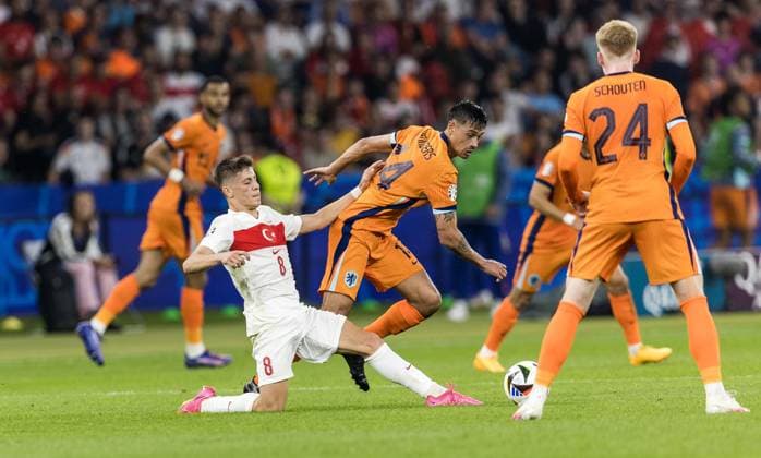 Netherlands v Turkey - UEFA EURO, EM, Europameisterschaft,Fussball 2024: Quarter-Final Arda Guler , Tijjani Reijnders , Jerdy Schouten during the UEFA Euro 2024 Quarter Final match between Netherlands v Turkey, at the stadium in Berlin, Germany, on July 6, 2024. Berlin Germany  Copyright: xFotoxOlimpikx originalFilename:jastrzebowski-netherla240706_npK2e.jpg
