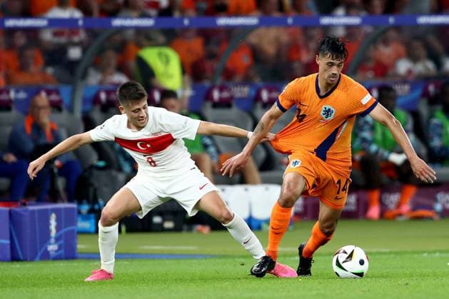 06.07.2024, xtgx, Fussball EM 2024 1 4 Finale, Niederlande - Türkei emspor, v.l. Arda Güler (Türkei Tuerkei) Tijjani Reijnders (Niederlande) Zweikampf, Aktion, action, battle for the ball (UEFA REGULATIONS PROHIBIT ANY USE OF PHOTOGRAPHS as IMAGE SEQUENCES and or QUASI-VIDEO) Berlin