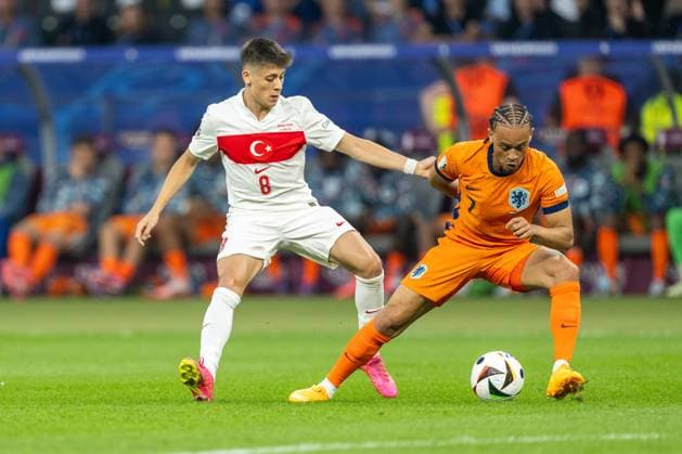 Netherlands v Turkiye, UEFA EURO, EM, Europameisterschaft,Fussball 2024, Berlin, Germany Berlin, Germany. 06th, July 2024. Xavi Simons (7) of the Netherlands and Arda Güler (8) of Turkey seen during the UEFA Euro 2024 quarter final match between Netherlands and Turkiye at Olympiastadion in Berlin. Berlin Germany  Copyright: xGonzalesxPhoto FrederikkexJensenx