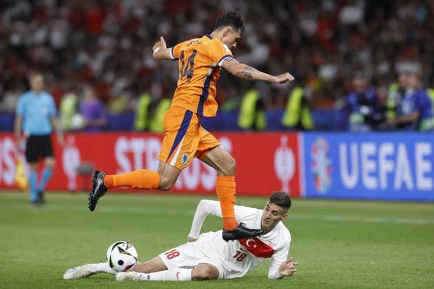 BERLIN, 06-07-2024, Olympia Stadium , European Football Championship Euro2024, Quarter finals match no.47 between Netherlands and Turkiye Netherlands player Tijjani Reijnders, Turkiye player Mert Muldur. Netherlands - Turkiye (Euro2024)  x25698867x Copyright:
