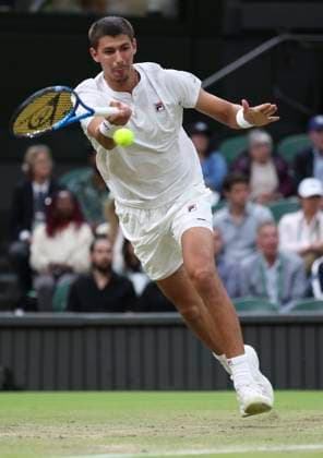 (240707) -- LONDON, July 7, 2024 -- Alexei Popyrin hits a return during the men s singles third round match between Novak Djokovic of Serbia and Alexei Popyrin of Australia at Wimbledon tennis Championship in London, Britain on July 6, 2024. ) (SP)BRITAIN-LONDON-TENNIS-WIMBLEDON HanxYan 